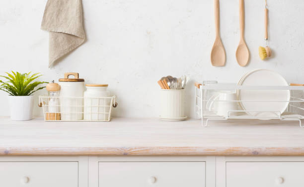 istock Kitchen utensils on cabinet table with space for product display 1493404912