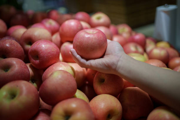 Close-up of hand holding an apple