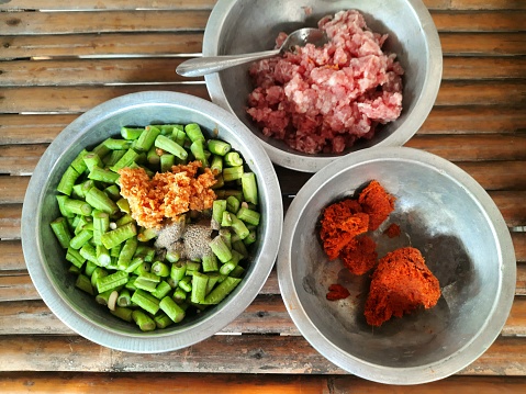 Cooking Stir fried Green pea with minced pork in Chili paste - food preparation.