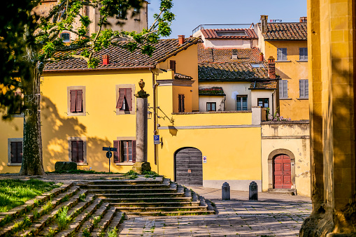 A beautiful and harmonious glimpse of the streets and stone houses in the historic and medieval heart of Arezzo, in Tuscany, central Italy. Arezzo, founded in Etruscan times and later becoming an important center of Ancient Rome, is famous for the innumerable artistic and architectural treasures of its medieval and Renaissance heart. Image in High Definition quality.