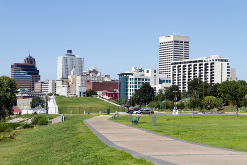 View of the Memphis, Tennessee city skyline from a park in the downtown area.