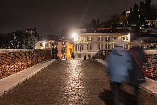 Verona, Italy 17 December 2022: Verona Ponte Pietra at night