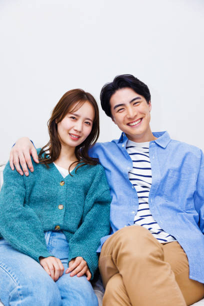 istock Japanese couple smiling at the camera 1493419419