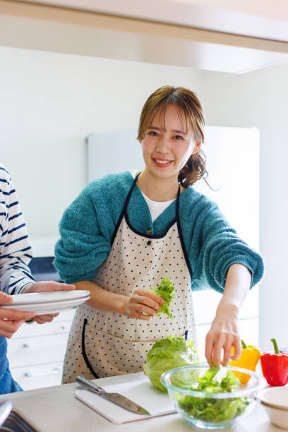 istock Japanese couple preparing to cook in kitchen 1493420185