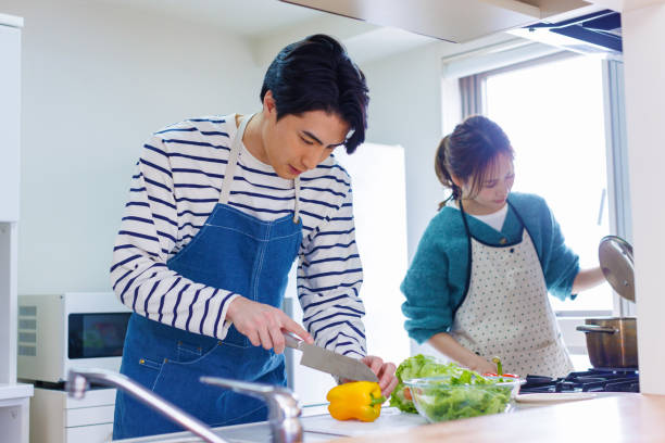 istock Japanese couple preparing to cook in kitchen 1493420747
