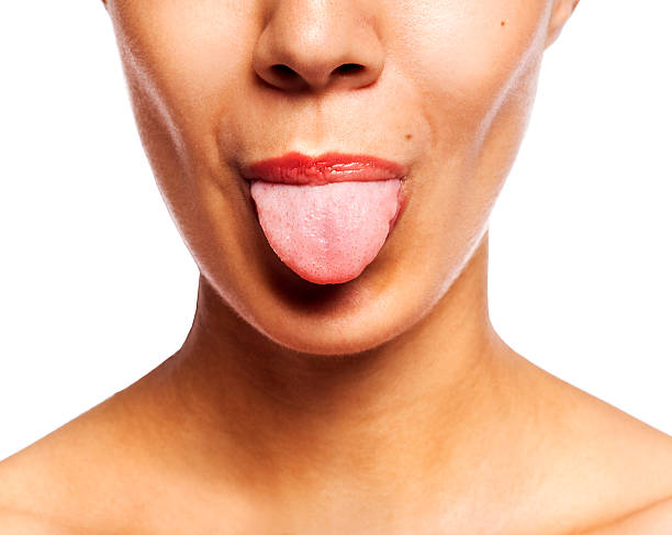 istock Young cheerful girl showing tongue 149342224