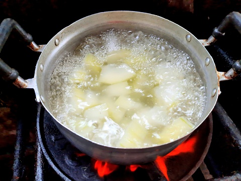 Cooking Wax Gourd Soup on stove - food preparation.