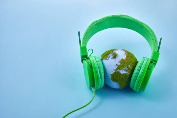 istock World music day concept. Stereo headphone and a globe on a blue background 1493424851