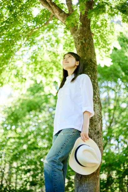 istock Japanese woman relaxing at forest 1493424997