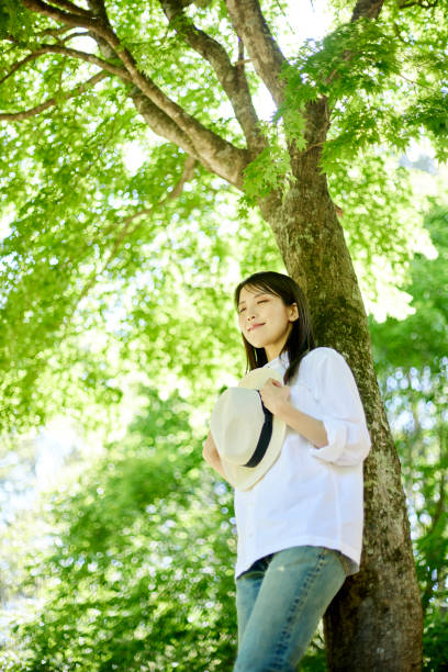 istock Japanese woman relaxing at forest 1493424999