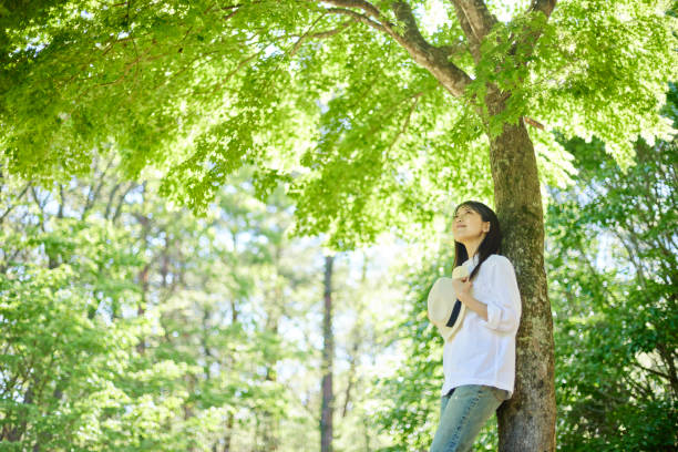 Japanese woman relaxing at forest