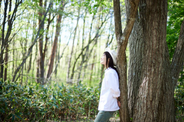 istock Japanese woman relaxing at forest 1493425597