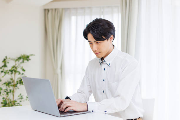 istock Japanese man working at home 1493426401