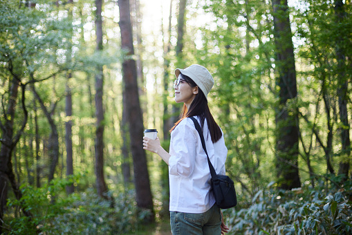 Japanese woman relaxing at forest