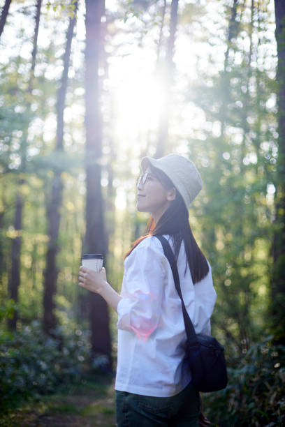 istock Japanese woman relaxing at forest 1493426466