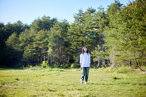 Japanese woman relaxing at forest