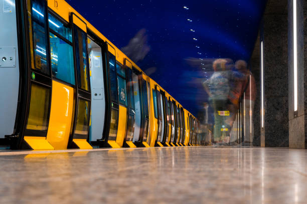 subway train stops in new blue metro station in Berlin