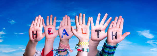 istock Children Hands Building Word Health, Blue Sky 1493426851