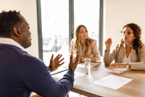 istock Man talking about his skills and education during a job interview meeting 1493426983