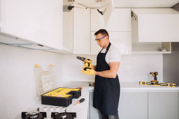 istock Maintenance man installing kitchen furniture 1493428191