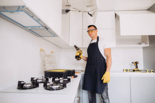 istock Maintenance man installing kitchen furniture 1493428193