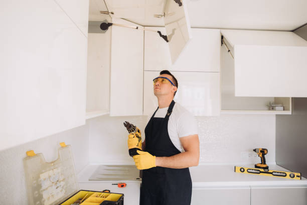 istock Maintenance man installing kitchen furniture 1493428217
