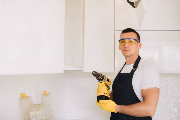 istock Maintenance man installing kitchen furniture 1493428226