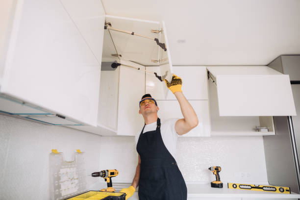istock Maintenance man installing kitchen furniture 1493428236