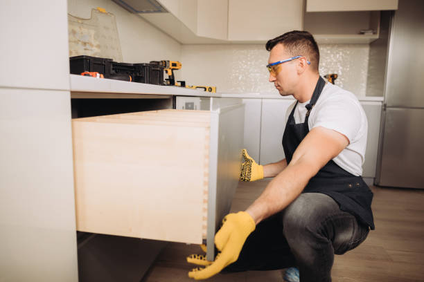 istock Maintenance man installing kitchen furniture 1493428408