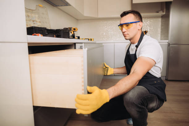 istock Maintenance man installing kitchen furniture 1493428463