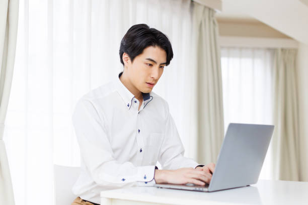 istock Japanese man working at home 1493429246