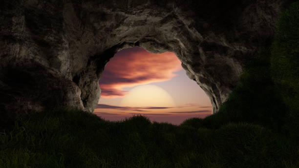 istock View from deep cave with grass, hole in rocky mountain, sunset. 3d render 1493429654