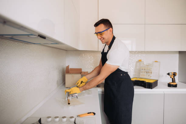 istock Maintenance man is going to install  plumbing equipment in the kitchen 1493429698