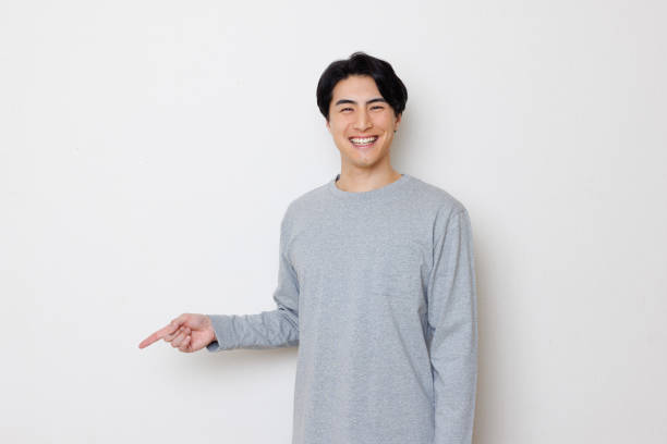 istock Japanese man smiling and pointing 1493430343