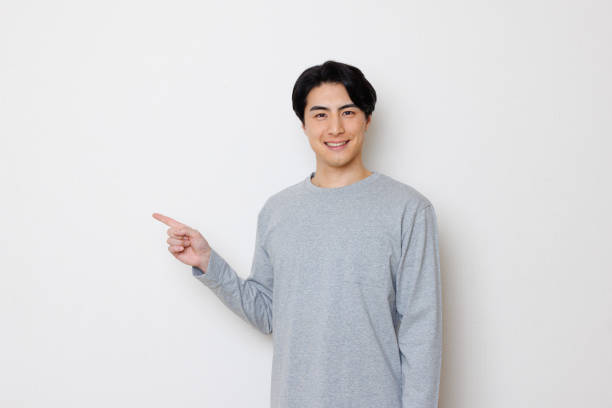 istock Japanese man smiling and pointing 1493430344