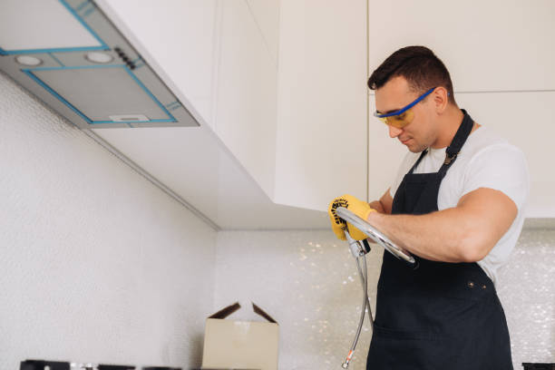 istock Maintenance man is going to install  plumbing equipment in the kitchen 1493430884