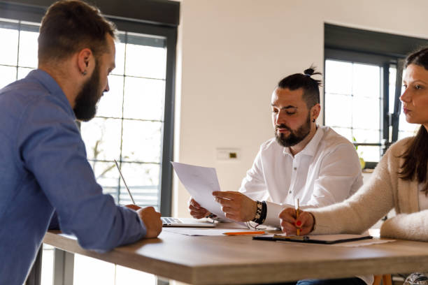 istock Interviewers analyzing a resume and questioning a person applying for the job 1493430887