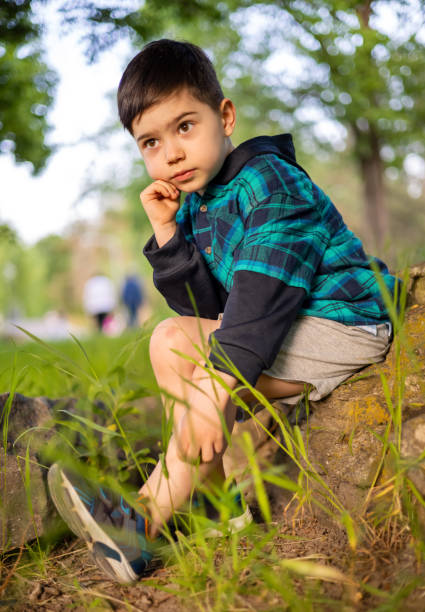 istock child kid boy walking in park 1493431078