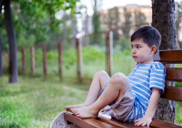 istock child kid boy walking in park 1493431113