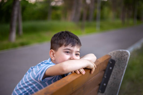 istock child kid boy walking in park 1493431135
