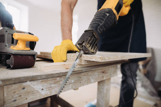 istock Maintenance man using a power saw to fix furniture 1493431510
