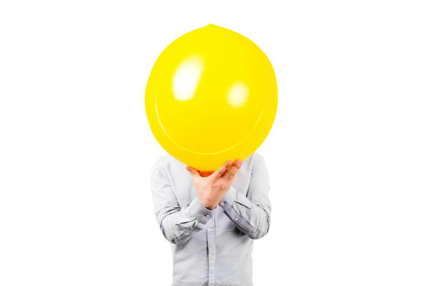 istock man holding yellow balloon. Positive thinking concept, isolated on white background 1493436449
