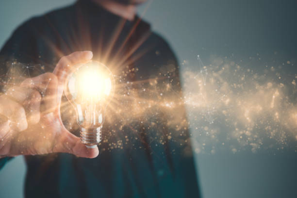 istock Business man holding light bulb. New idea, innovation technology and creative concept. 1493444810