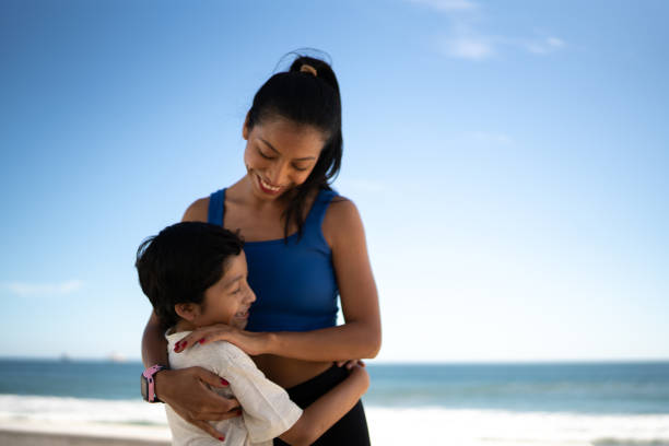 istock Mother and son embracing outdoors 1493445239