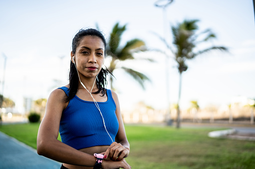 Portrait of young sporty woman outdoors