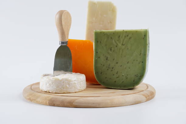 istock Various types of cheese on wooden cutting board 1493446575