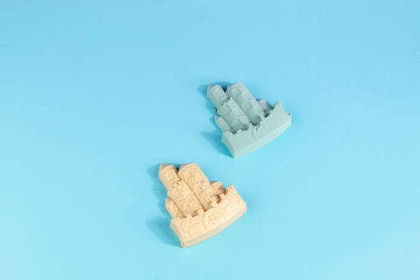 istock Blue sand castle and castle mold summer beach concept on blue background 1493448340