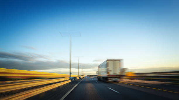 istock Heavy Semi Truck at highway, blurred in motion 1493448661