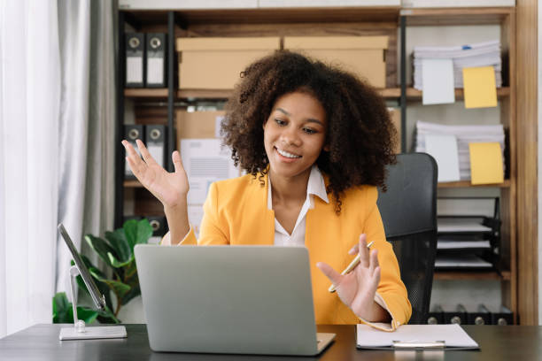 istock Businesswoman involved in laptop call conversation working on computer, giving professional consultation to client or negotiating project. 1493449578
