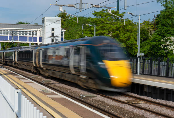 istock High speed train passing through a station at speed. 1493456271